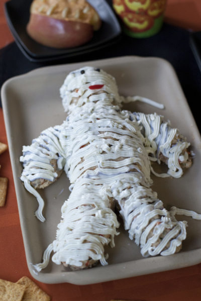 This cute cheese ball mummy is surprisingly easy to make and the perfect savory treat for your Halloween party. From EatingRichly.com