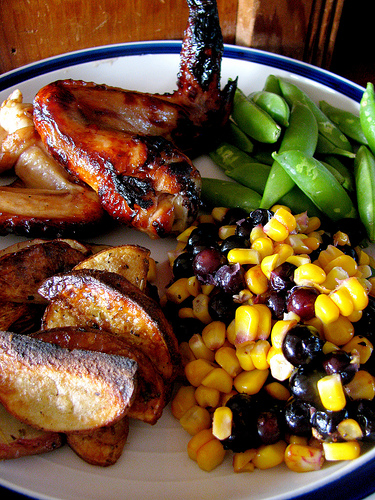 Blueberry corn salad served with BBQ chicken, oven potato wedges, and sugar snap peas