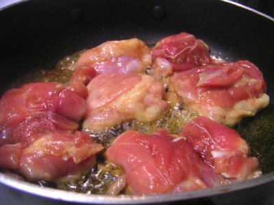 Pan frying teriyaki chicken thighs in oil