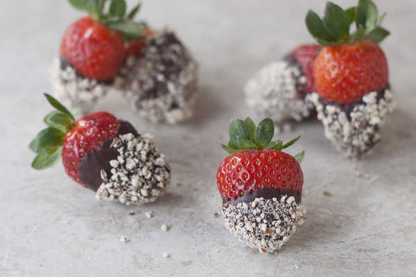 Fresh strawberries are dipped in dark chocolate and chopped almonds for an easy gourmet Valentine's dessert at EatingRichly.com