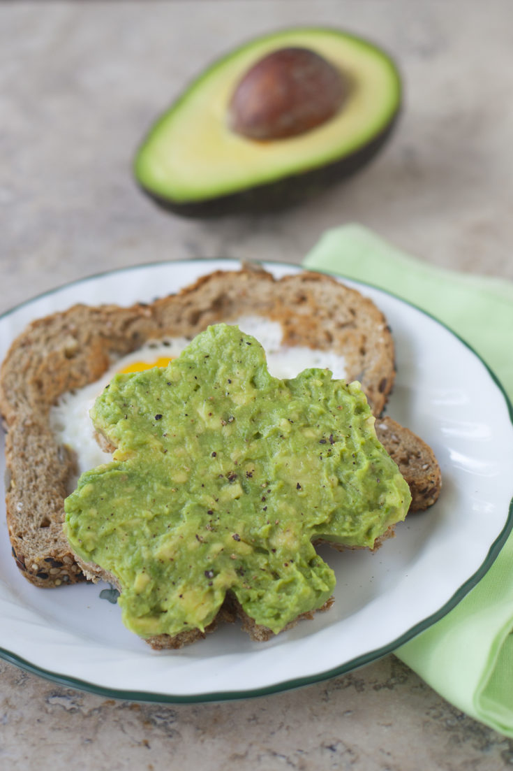 Edible Art Projects for Kids: A healthy St. Patrick's Day breakfast of shamrock avocado toast. From EatingRichly.com