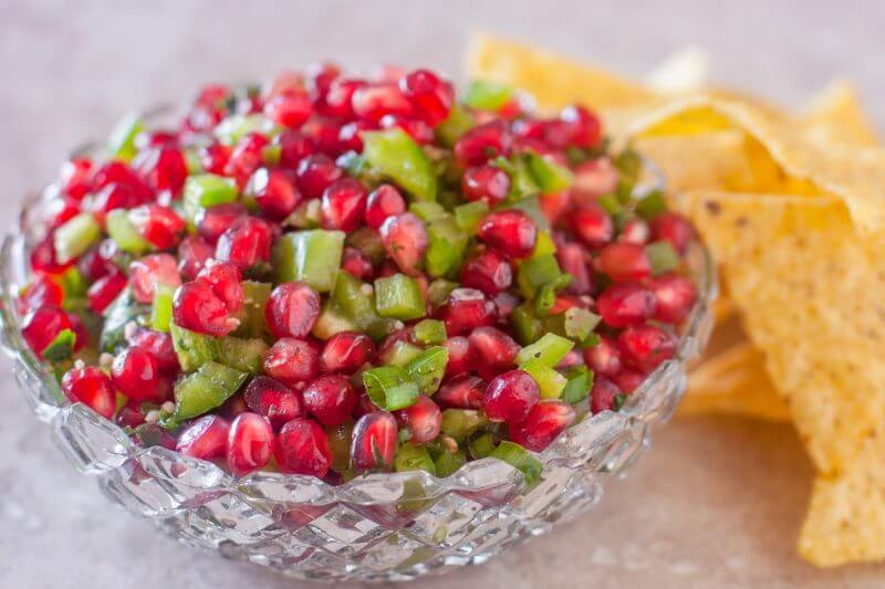 This fresh pomegranate salsa recipe is always tasty, but it's especially fun for Christmas parties with it's beautiful bright red and green colors. From EatingRichly.com