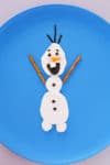 This cute Olaf snowman cheese snack is a healthy snack that's sure to delight your Frozen loving kids. Ready in 10 minutes or less! From EatingRichly.com