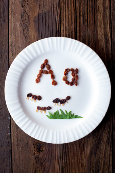 Easy alphabet kids snacks create a fun edible learning experience and preschool reading introduction. These raisin ants teach kids that A is for Ant. From EatingRichly.com.