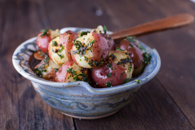 This easy new potatoes recipe is flavored with fresh garlic and parsley and ready in just 30 minutes. From EatingRichly.com