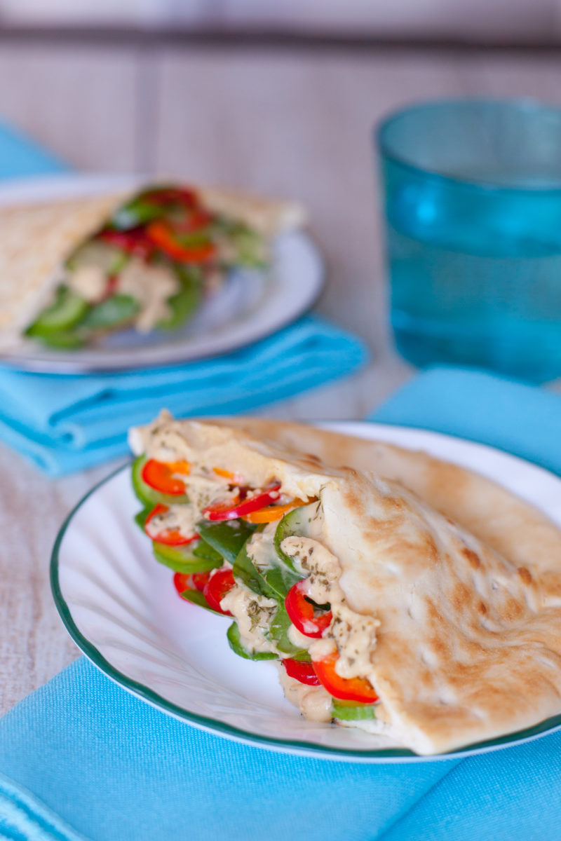 These simple vegetarian pita sandwiches are packed with fresh veggies & hummus, making them the perfect easy healthy breastfeeding recipe for new moms. From EatingRichly.com