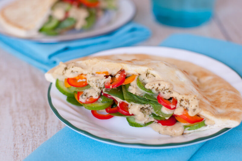 These simple vegetarian pita sandwiches are packed with fresh veggies & hummus, making them the perfect easy healthy breastfeeding recipe for new moms. From EatingRichly.com
