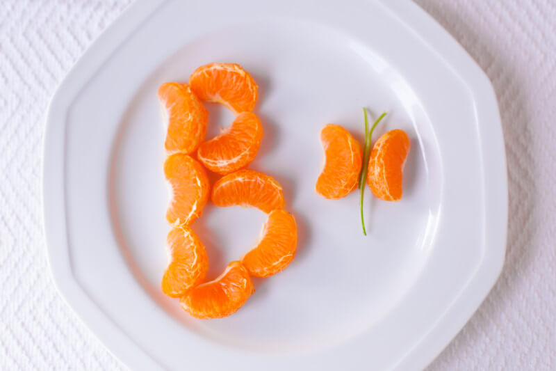 This cute healthy kid snack uses tangerines to teach preschoolers the alphabet. B is for butterfly! - EatingRichly.com