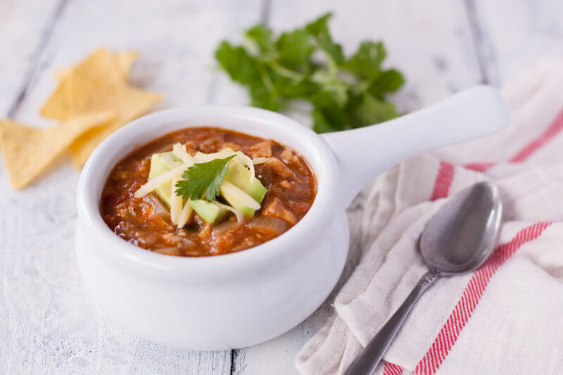 This easy chicken tortilla soup recipe is true comfort food. Ready in under 1 hour, & you control the amount of heat. You'll make this soup again and again! From EatingRichly.com