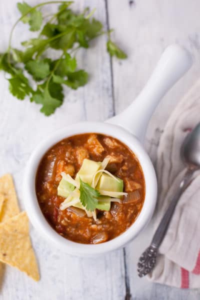 This easy chicken tortilla soup recipe is true comfort food. Ready in under 1 hour, & you control the amount of heat. You'll make this soup again and again! From EatingRichly.com