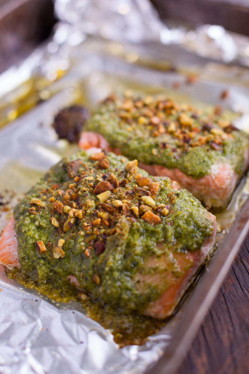 This easy salmon recipe is simple enough for a toddler to make! Kids love the colorful pesto & crunchy pistachios, making it a perfect way to introduce fish to your little ones. Part of #MiniChefMondays on EatingRichly.com