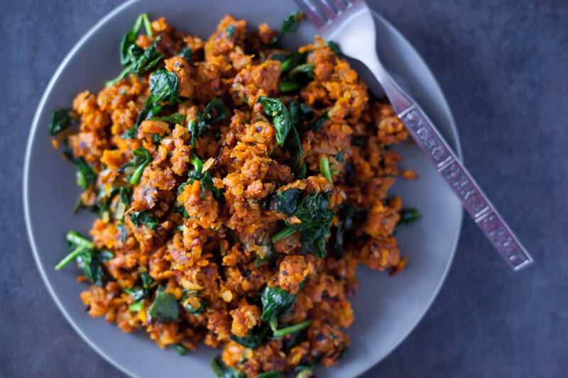 This colorful paleo sweet potato hash recipe has just four ingredients, and packs a nutritional punch that makes it a fantastic side dish for breakfast, lunch, or dinner. Great paleo and vegan St. Patrick's Day recipe! From EatingRichly.com