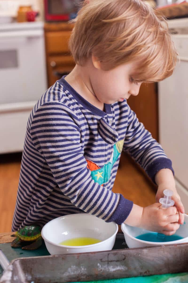 This toddler science experiment teaches how baking soda and vinegar react, while making a colorful art project. You toddler won't believe their eyes! Part of #MiniChefMondays on EatingRichly.com