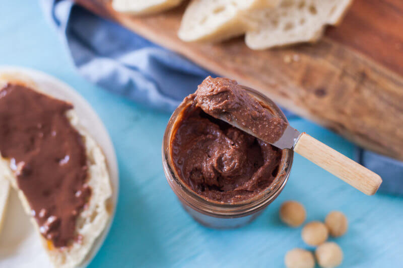 This coconut chocolate macadamia nut butter is heaven in a jar. Just four ingredients & vegan, dairy free, & paleo. You will not believe how good it is! From EatingRichly.com