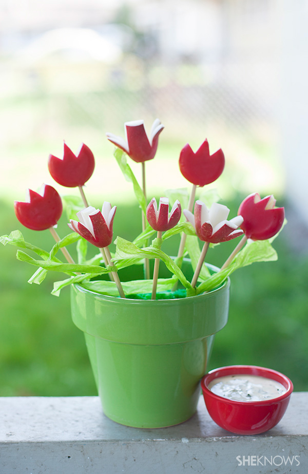 Spring radishes and Babybel cheeses are easy to carve into tulips and make a cute, edible, flower arrangement for mom. Check out all ten cute edible Mother's Day gifts at EatingRichly.com
