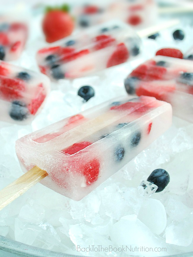 Coconut Water and fresh berry popsicles. Get more recipes for healthy 4th of July desserts at EatingRichly.com