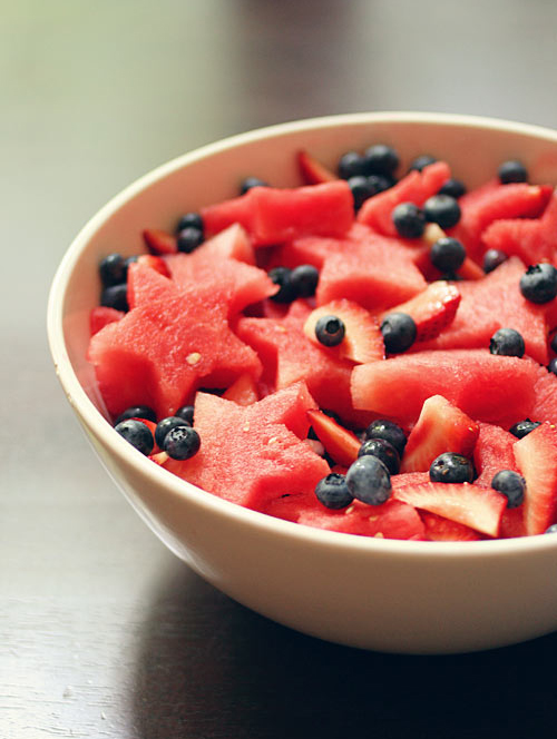 Watermelon stars and fresh berries make a great patriotic salad. Get more 4th of July Snacks that kids can make at EatingRichly.com