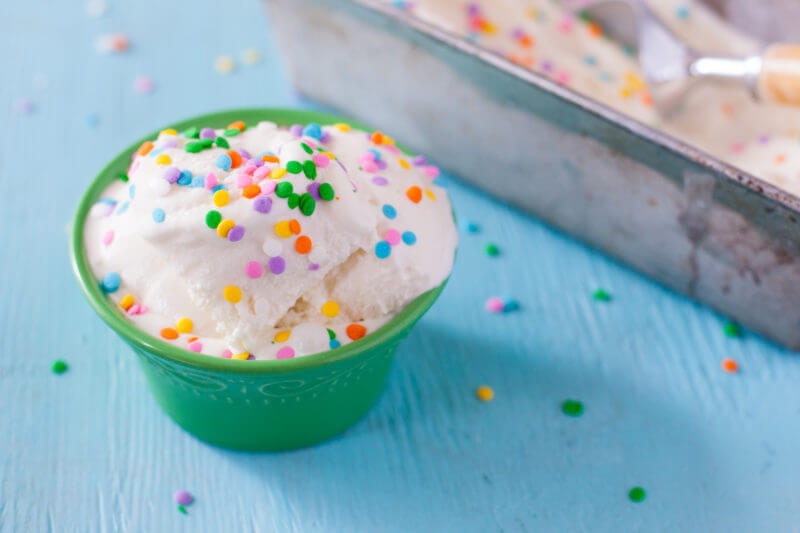 Kids can make this cake batter ice cream recipe because it doesn't require any cooking. Simply mix and churn for amazing ice cream that tastes just like birthday cake! From EatingRichly.com