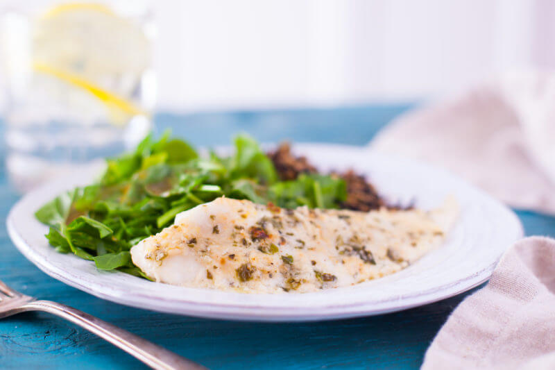 Hands down the best tilapia recipe ever. Flavorful lemon parmesan tilapia is quickly broiled for a delicious tilapia recipe that's 15 minutes start to finish! From EatingRichly.com
