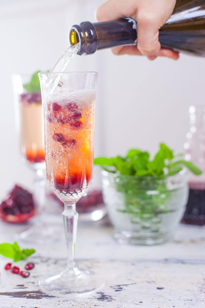 This pomegranate mint champagne cocktail will wow your holiday party guests, and is easy to set up as a DIY cocktail bar so YOU can focus on socializing. From EatingRichly.com