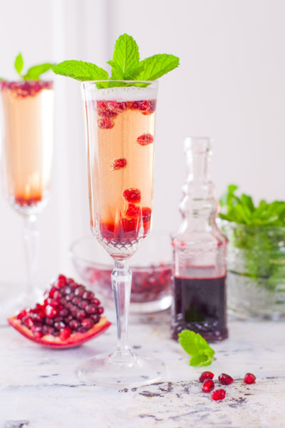 This pomegranate mint champagne cocktail will wow your holiday party guests, and is easy to set up as a DIY cocktail bar so YOU can focus on socializing. From EatingRichly.com