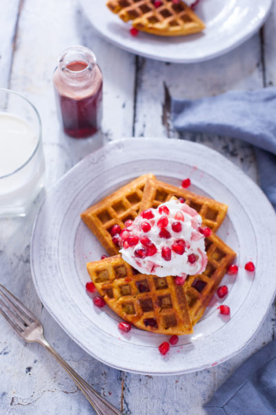 This sweet potato waffles recipe makes perfectly crisp, healthy waffles, and tops them off with an amazing sweet and tangy pomegranate syrup. From EatingRichly.com