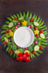 This veggie wreath is a festive way to dress up your holiday appetizer. It's almost too pretty to eat. From EatingRichly.com