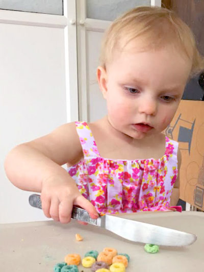 Cutting cereal with a table knife is a great way to teach toddlers knife safety. Get more tips plus the best kids kitchen knife at EatingRichly.com