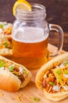 These slow cooker hot dogs are swimming in a chili cheese hot tub of deliciousness, and only need THREE ingredients. Which means you can have a cold beer and play with the kids instead of standing over a hot stove! From EatingRichly.com