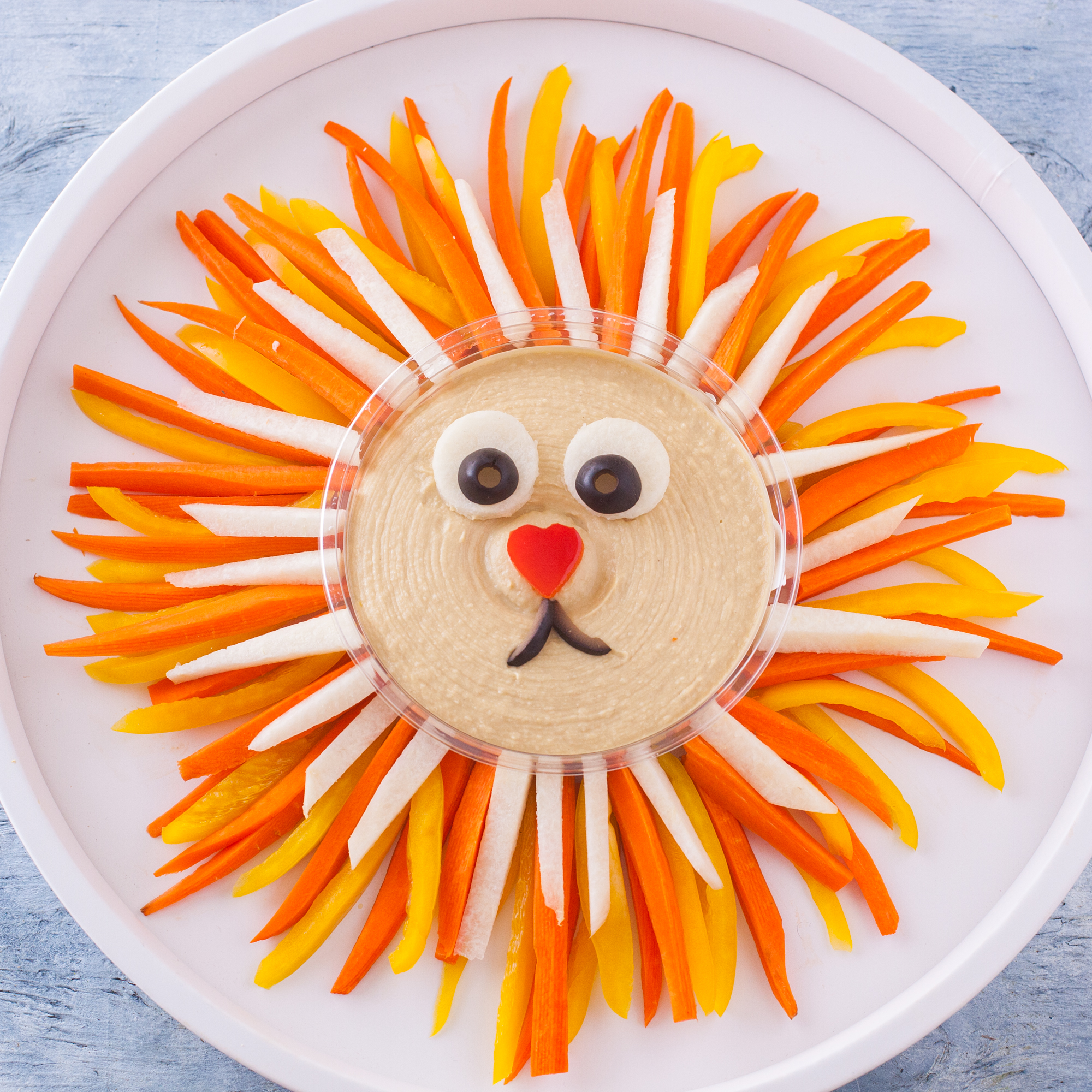 Kids and adults love this cute lion vegetable tray so much, they will stuff themselves on veggies without even realizing it! From EatingRichly.com