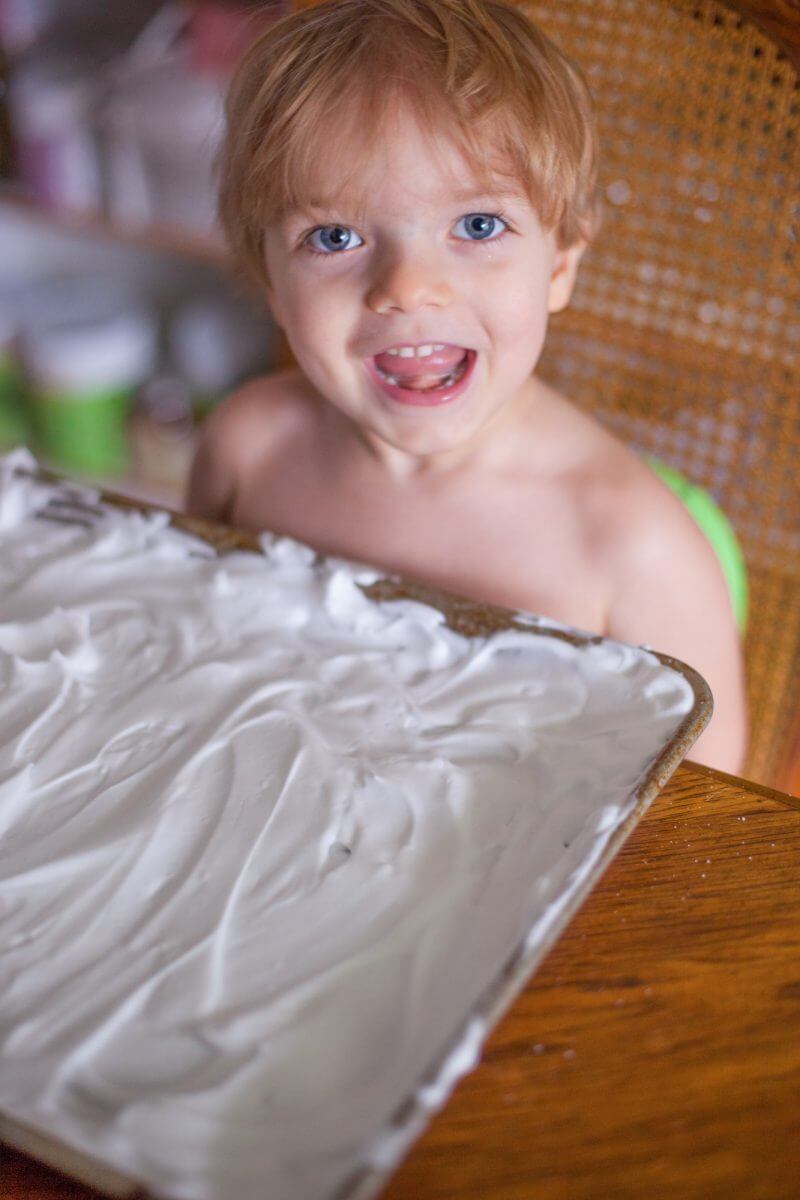 having cream paint is a fun way for your toddler to create beautiful marbled works of art, and get some sensory play at the same time!