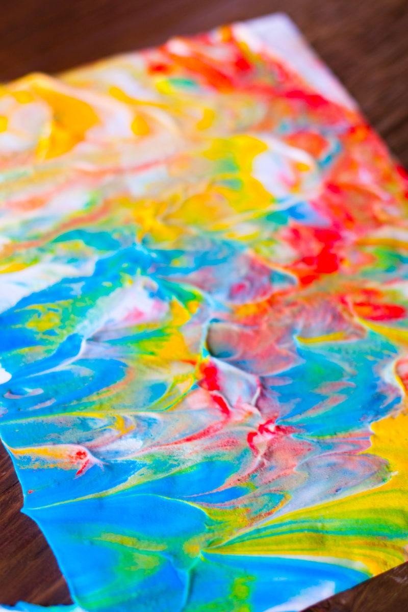 Shaving cream paint is a fun way for your toddler to create beautiful marbled works of art, and get some sensory play at the same time. From EatingRichly.com
