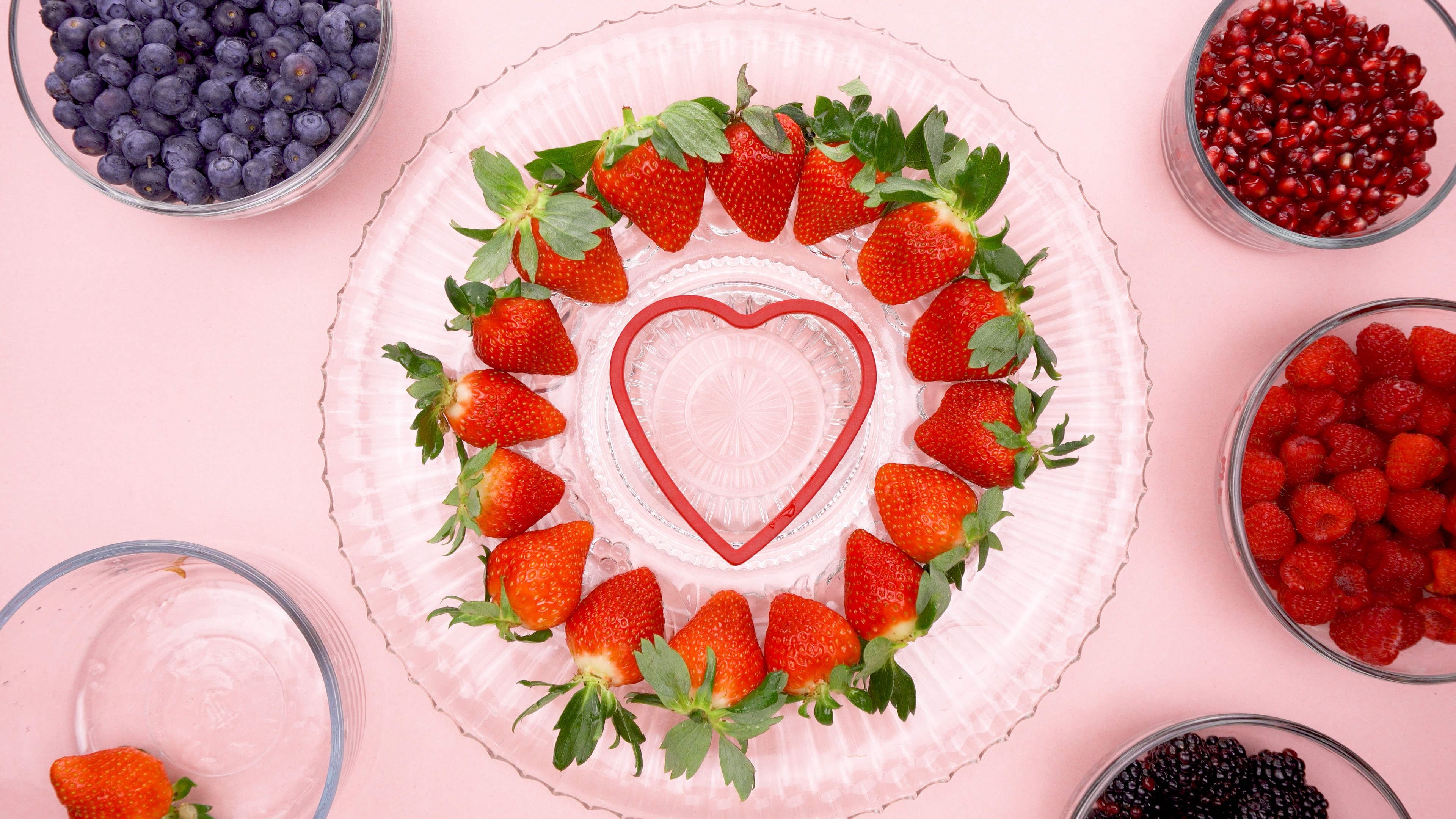 Strawberries around a heart cookie cutter