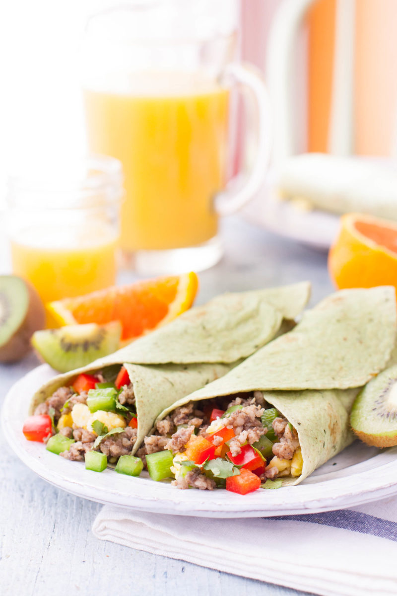 Breakfast Burrito plate with juice and fruit