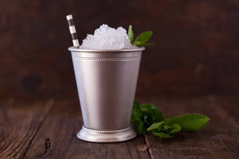 mint julep with crushed ice in a julep cup
