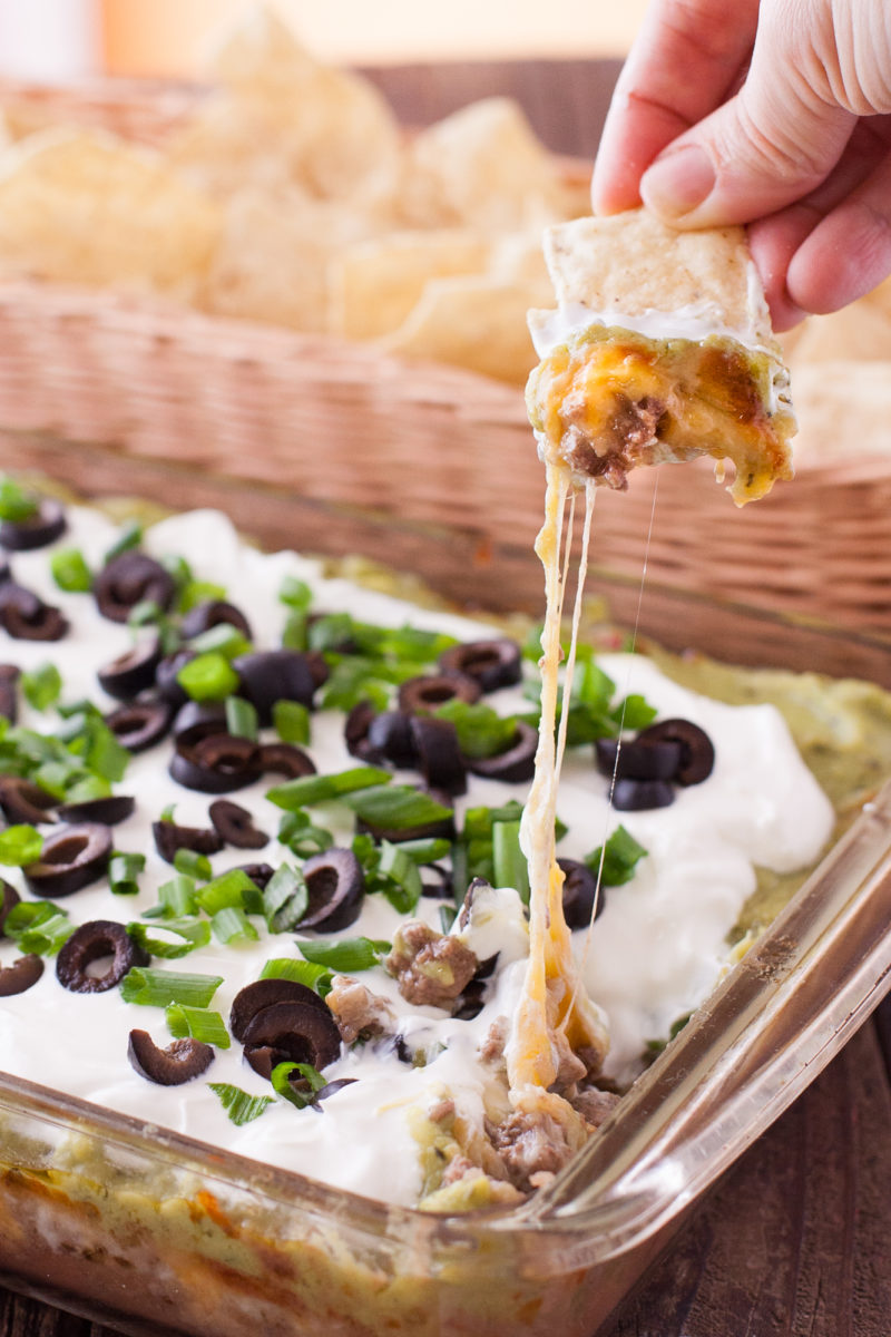 Baked 7 layer dip cheese melted