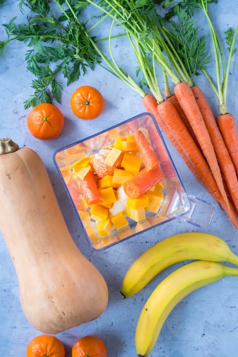 Tangerines, carrots, butternut squash, bananas in a blender 