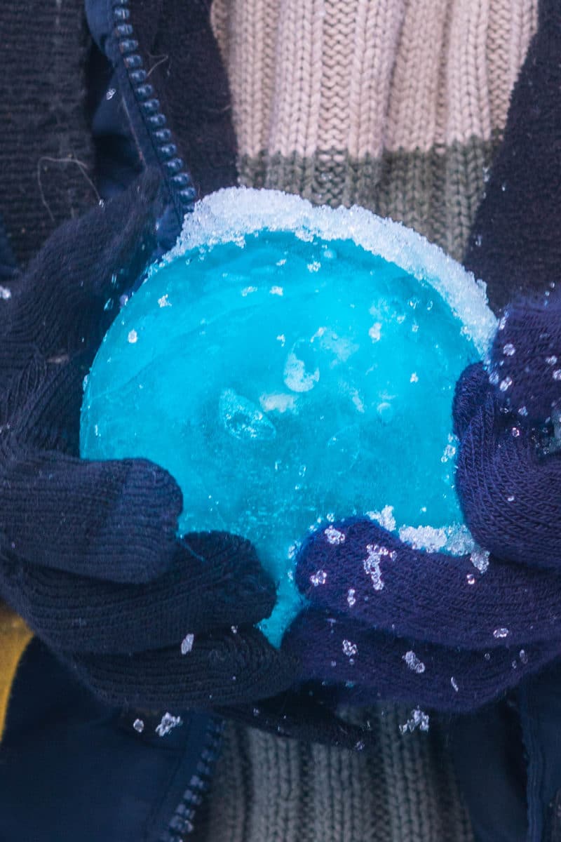 Holding a blue ice balloon