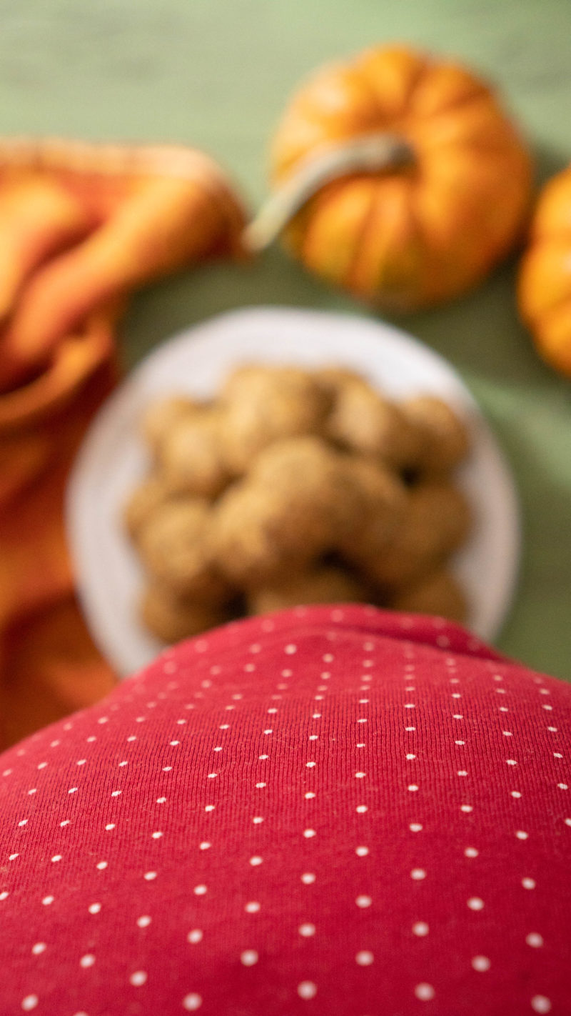 Pregnant belly photo bombing pumpkin energy balls
