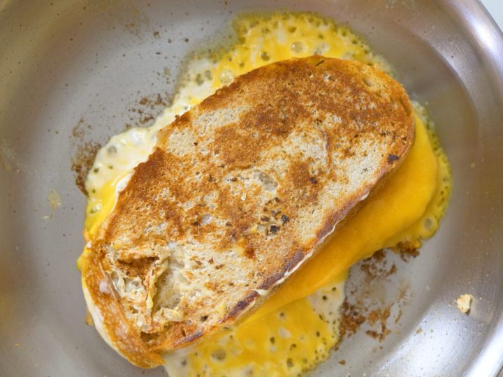 https://eatingrichly.com/wp-content/uploads/2020/05/leaking-grilled-cheese-in-skillet-square-720x540.jpg