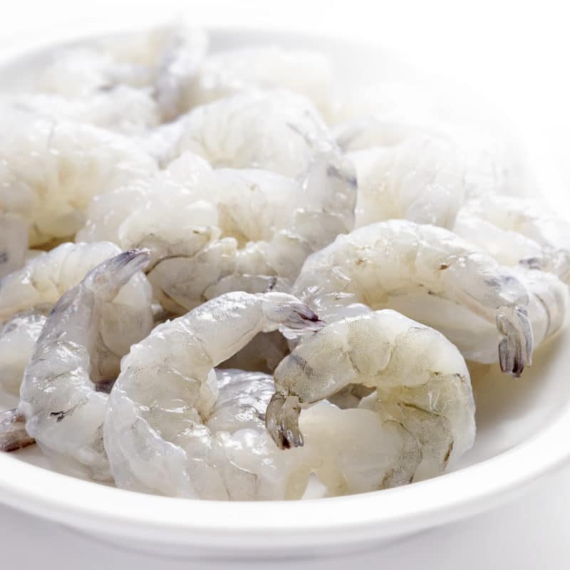 Raw shrimp in white bowl