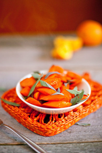 Sliced orange maple carrots with sage