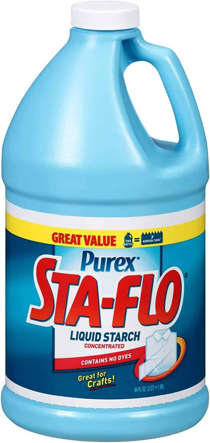 A big blue jug of Sta-flo liquid starch is isolated on a white background.
